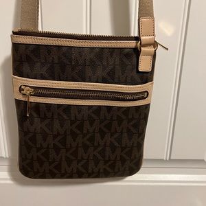 Michael Kors crossbody. Purchased in 2013. Great storage size. Asking $25 OBO.